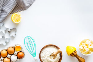 Cooking for Christmas or New Year dinner. Baking background. Dough ingredients on white background top view copy space