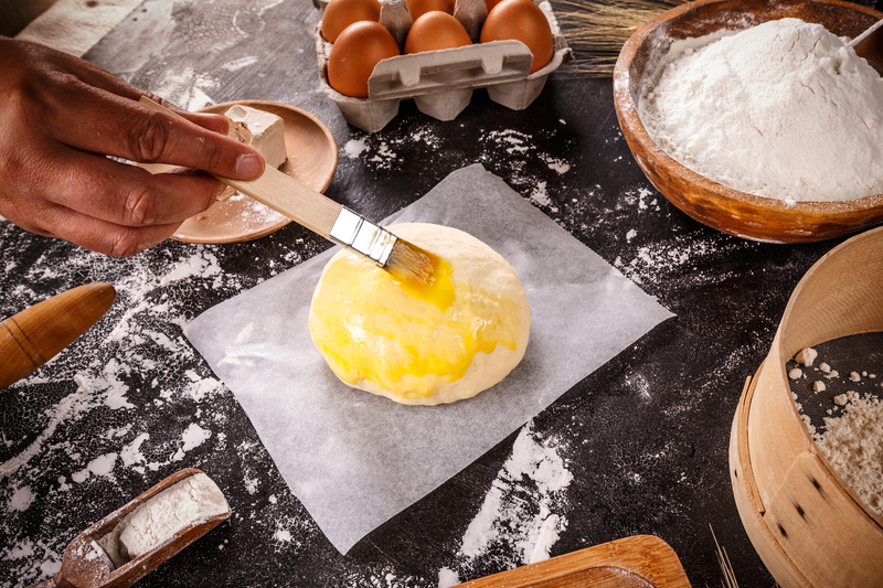 Should I Brush Bread with Butter Before Baking?