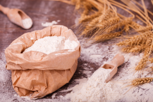 flour-in-bag-with-scoop-and-wheat-on-table-2026-01-05-00-37-03-utc